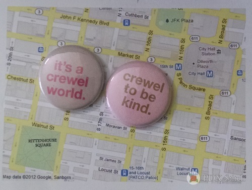 pins that read "it's a crewel world" and "crewel to be kind" from rittenhouse needlepoint