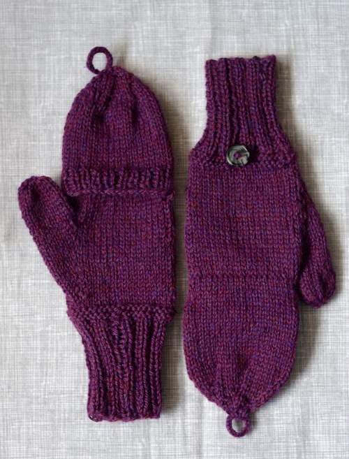 A pair of purple knitted mittens